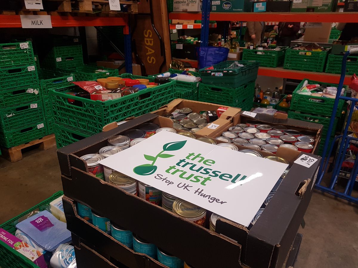 Volunteer sorting through food donations